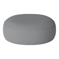 Round gray pouf with a textured fabric surface, perfect for modern decor.