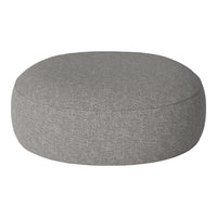 Round gray pouf with a textured fabric, perfect for modern decor. Soft, neutral color complements various styles.