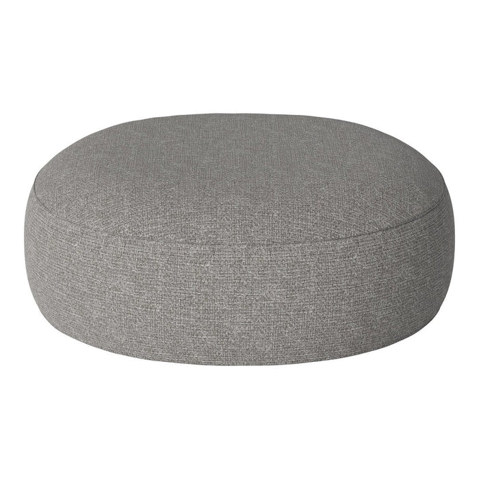 Round gray pouf with a textured fabric, perfect for modern decor. Soft, neutral color complements various styles.