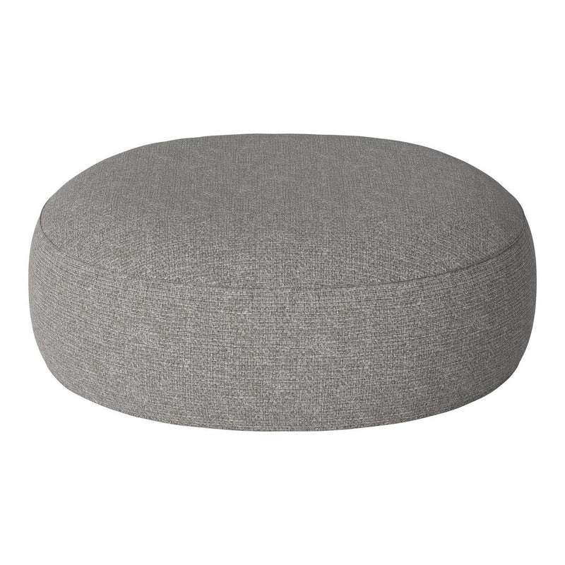 Round gray pouf with a textured fabric, perfect for modern decor. Soft, neutral color complements various styles.