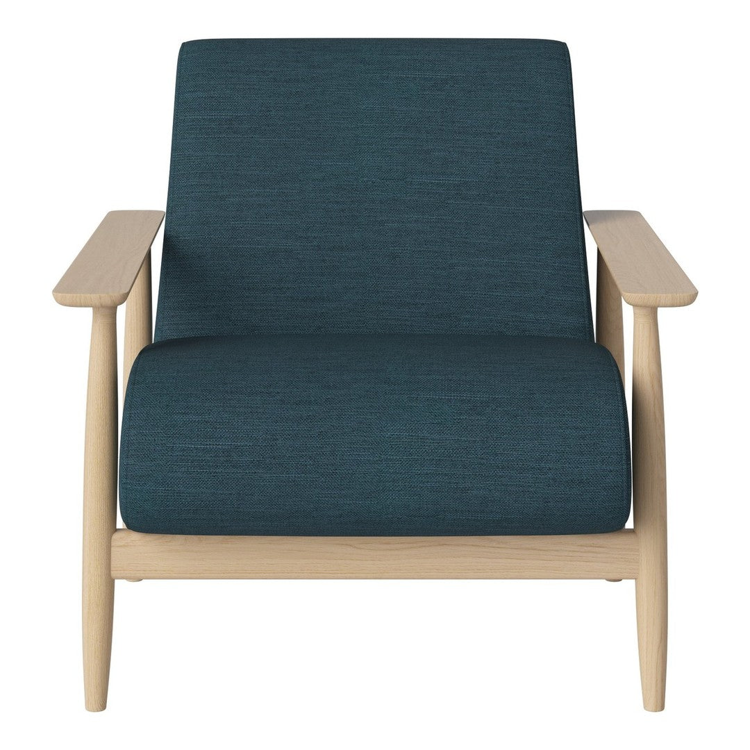 Teal textured upholstery on a modern chair with light wood arms, combining stylish colors and natural elements.