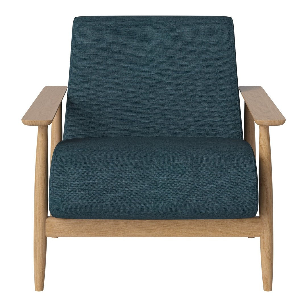 Teal textured fabric armchair with natural wood frame, minimalist design, and modern aesthetic.