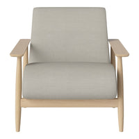 Light gray upholstered chair with natural wood arms and legs, offering a minimalistic and modern design.