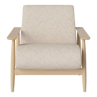 Light beige upholstered chair with a subtle texture, set on natural wood legs, offering a minimalist design.