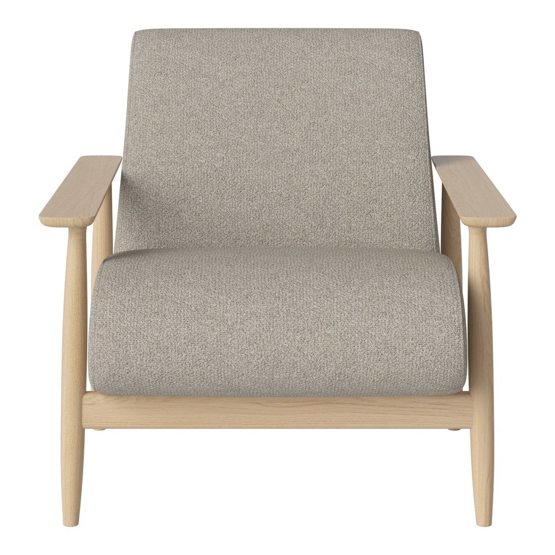 Light grey upholstered armchair with natural wood legs, minimalist design and no visible patterns.