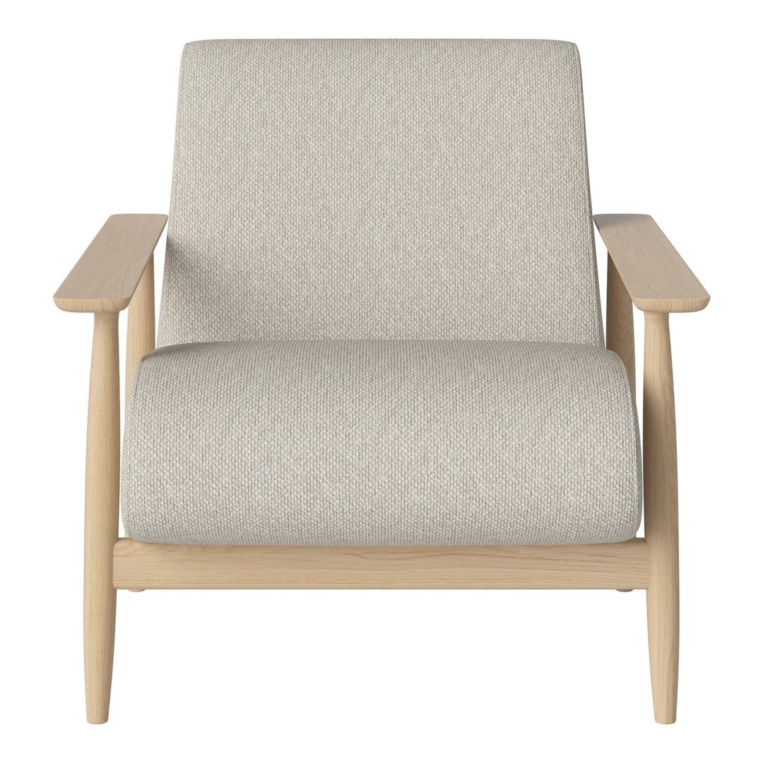 Light grey upholstered armchair with a minimalist design and natural wood armrests. Soft texture and simple pattern.