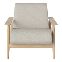 Light grey upholstered armchair with a minimalist design and natural wood armrests. Soft texture and simple pattern.