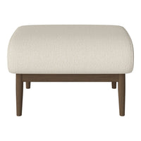 Cream upholstered ottoman with a textured finish and wooden legs, perfect for modern decor.