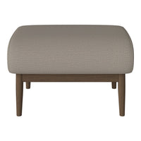 Beige textured ottoman with smooth curves and wooden legs, perfect for modern decor.