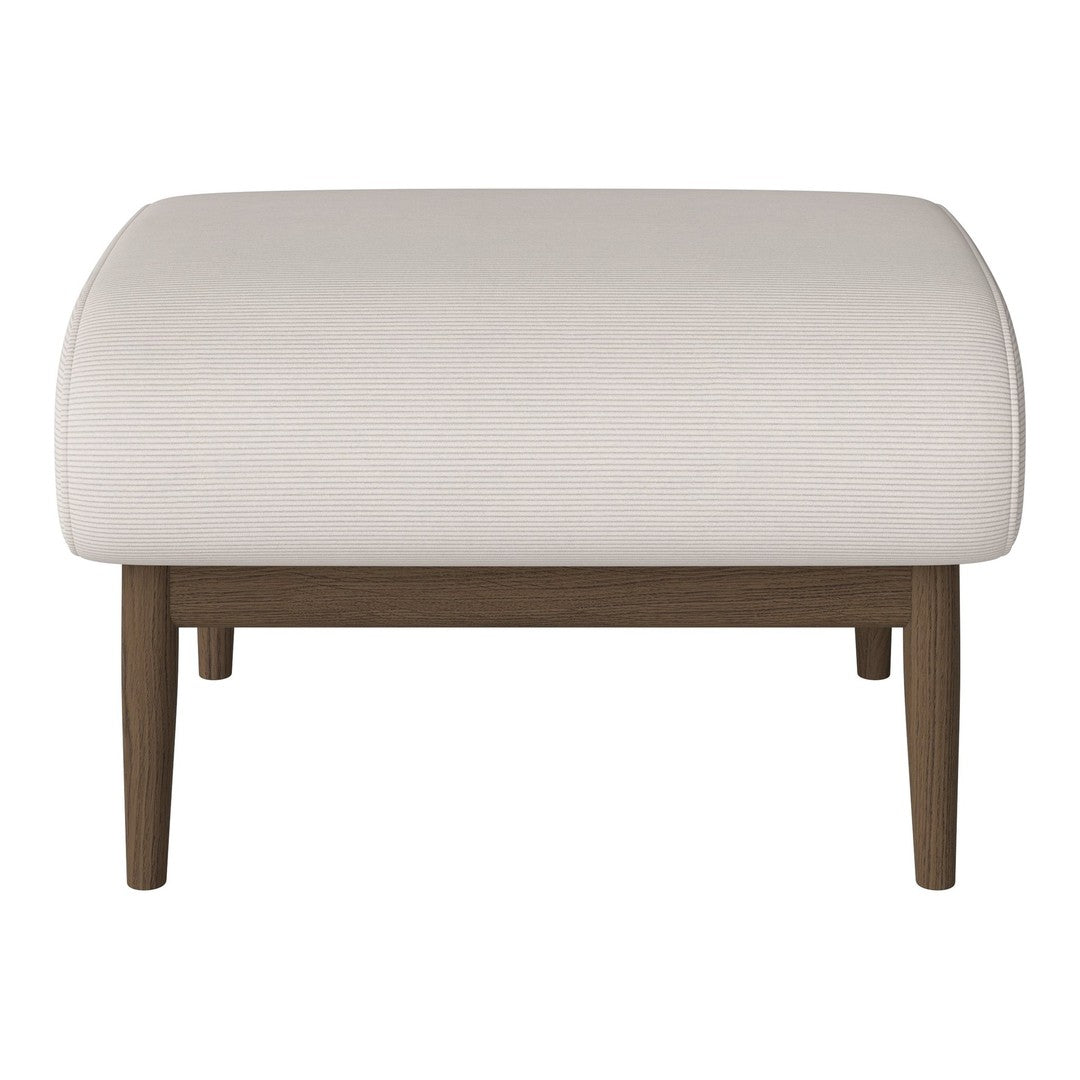 Cream upholstered ottoman with a smooth texture and dark wooden legs. Simple, modern design with a minimalist aesthetic.