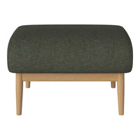 Dark green textured ottoman with a rounded top and light wood legs. Perfect for modern living spaces.
