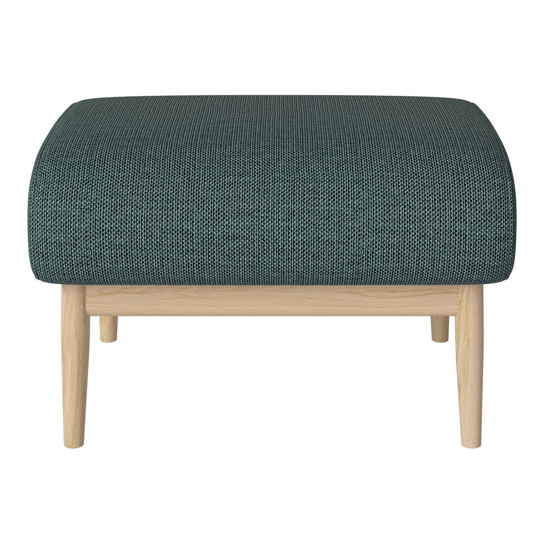 Teal textured ottoman with natural wood legs, offering a modern and stylish accent for any living space.
