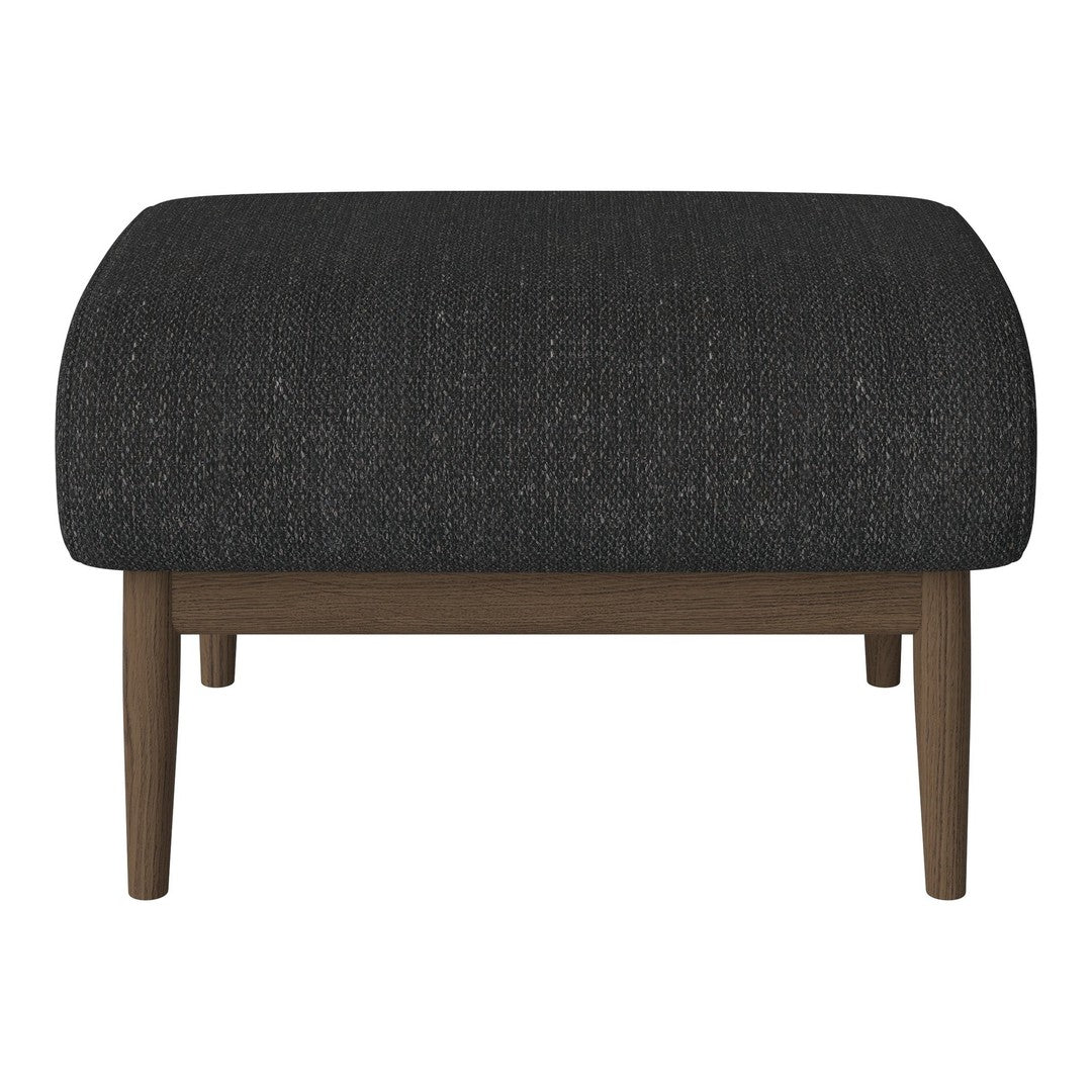 Black textured ottoman with a rounded shape and wooden legs, ideal for modern decor.
