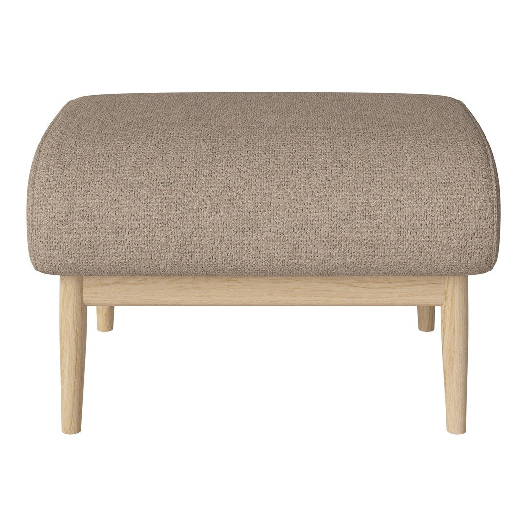 Light beige ottoman with a textured fabric and natural wood legs, showcasing a minimalist design.