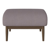 Plush light purple ottoman with smooth fabric and wooden legs, perfect for modern decor.