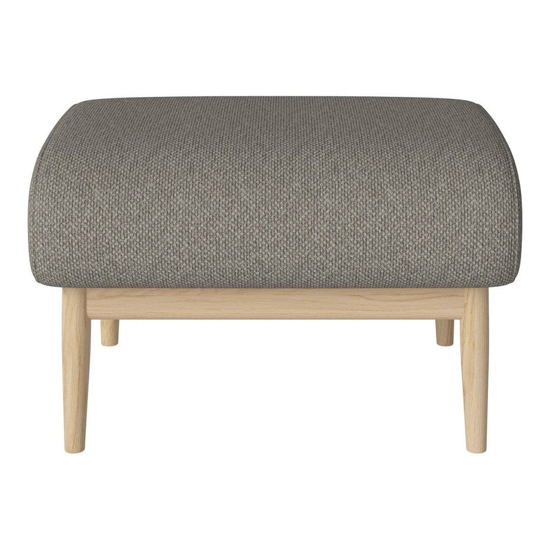 Gray upholstered ottoman with a textured pattern and light wooden legs, adding modern elegance to any space.