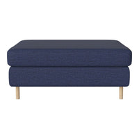 Navy blue fabric ottoman with a textured pattern and light wood legs. Stylish and modern home decor piece.