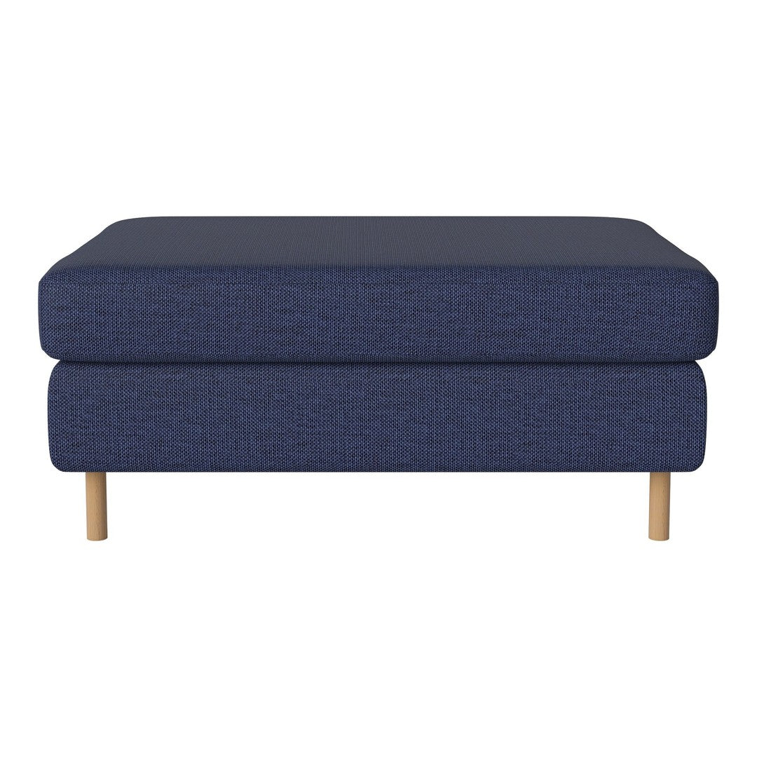 Navy blue ottoman with textured fabric and natural wood legs, perfect for modern interiors.