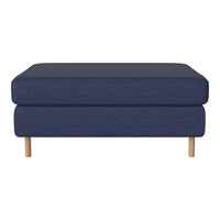 Navy blue upholstered ottoman with a textured pattern and wooden legs. Minimalist design for modern decor.