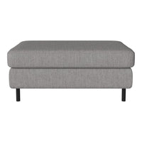 Soft gray upholstered ottoman with a textured pattern and sleek black legs. Perfect for modern living spaces.
