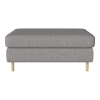 Gray upholstered ottoman with subtle texture and natural wood legs. Versatile design for modern decor.