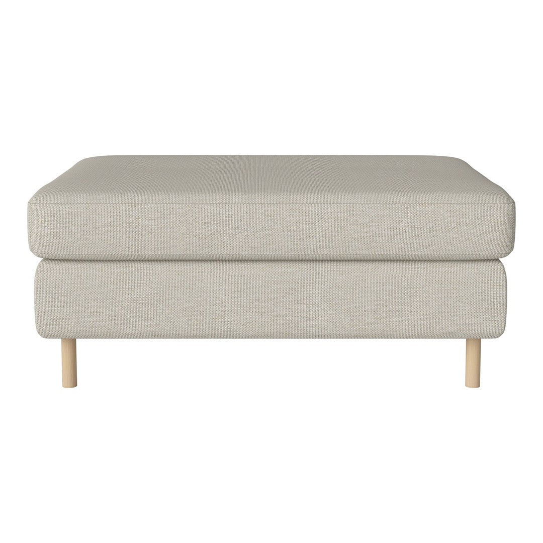 Neutral beige upholstered ottoman with a smooth texture and light wood legs, perfect for versatile home decor.