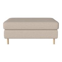 Beige upholstered ottoman with a smooth fabric texture and light wooden legs, perfect for modern decor.
