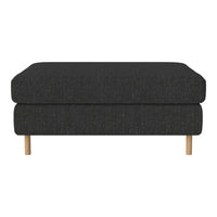 Dark gray upholstered ottoman with a smooth texture and wooden legs, showcasing minimalist design.