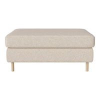 Neutral beige ottoman with a soft textured fabric and light wooden legs, perfect for modern decor.