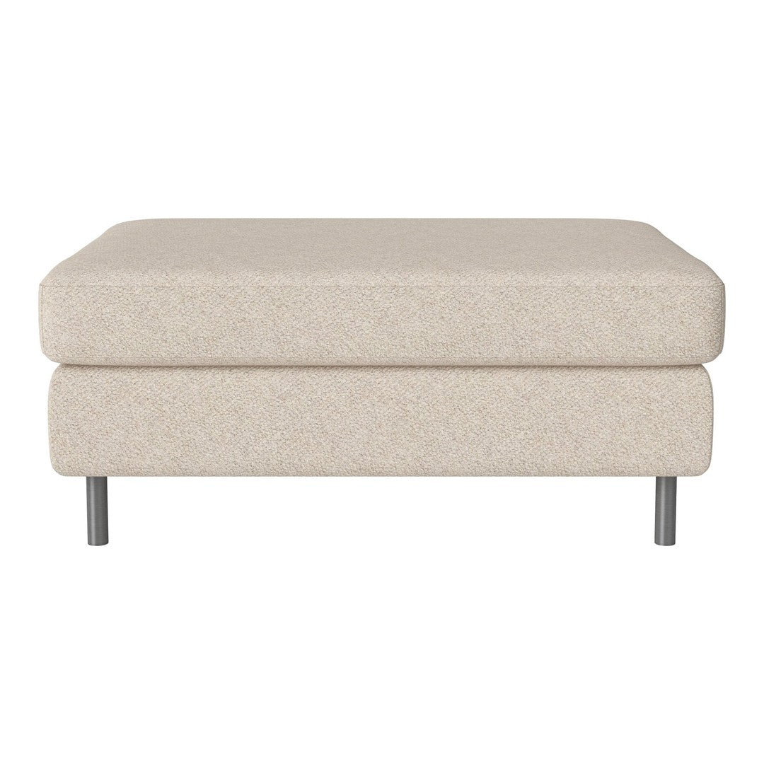 Beige textured ottoman with a modern design and sleek silver legs, perfect for any contemporary living space.