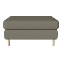 Olive green upholstered ottoman with a textured pattern, featuring natural wood legs. Modern and minimalist design.