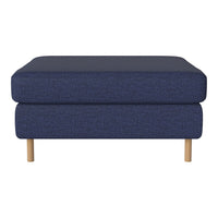 Navy blue upholstered ottoman with a textured pattern and light wood legs. Ideal for modern decor.