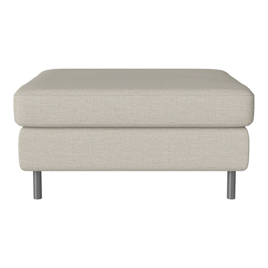 Light beige upholstered ottoman with a minimalist design and subtle textured fabric on silver legs.