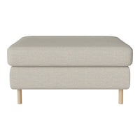 Light beige upholstered ottoman with a minimalist design and natural wood legs. Perfect for modern decor.
