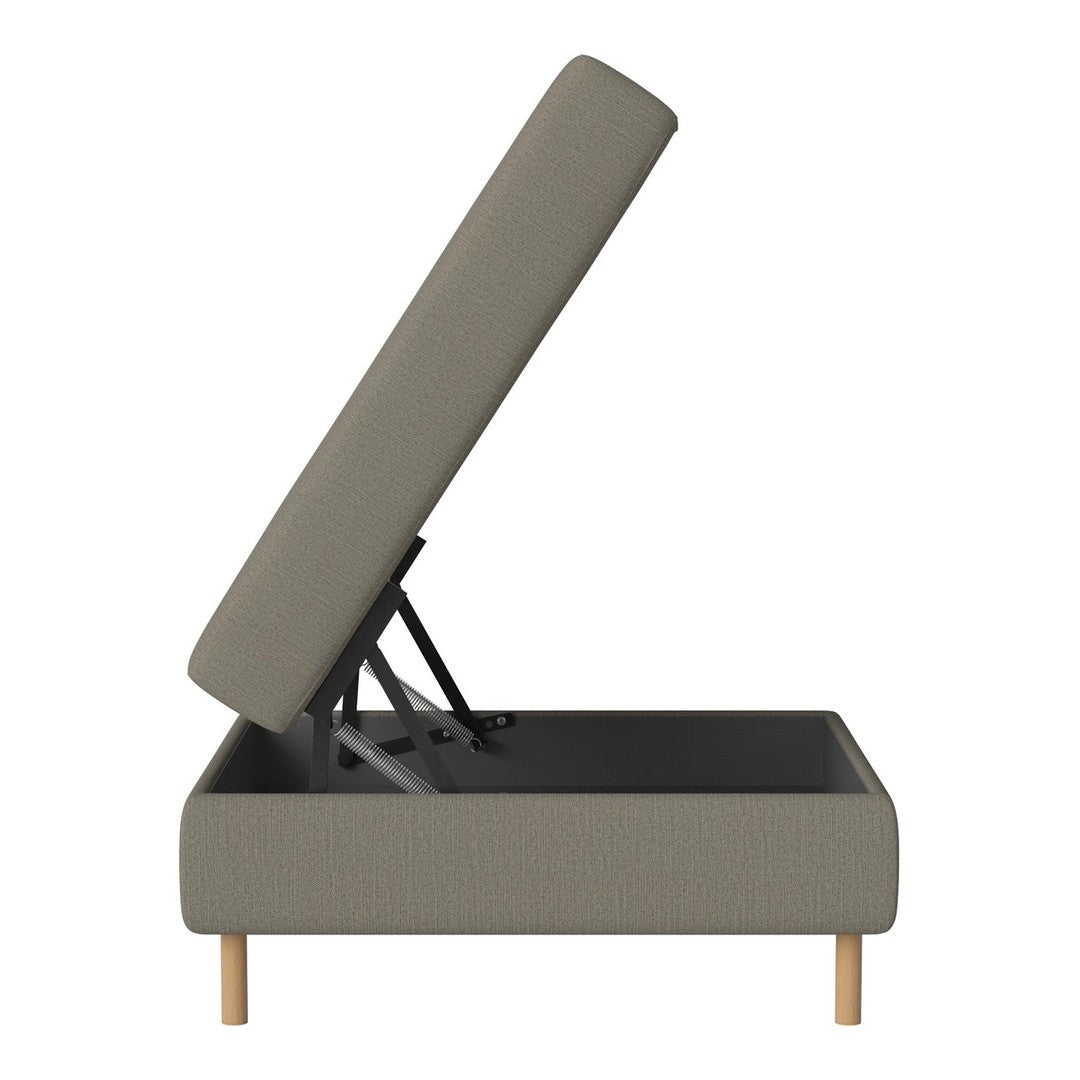 Gray upholstered ottoman with a lift-top design and natural wood legs, showcasing a textured fabric pattern.