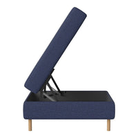 Navy blue upholstered storage bench with textured fabric and light wooden legs, showcasing modern design.
