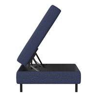 Navy blue upholstered storage ottoman with a simple textured pattern and black metal legs.