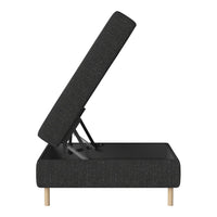 Modern black fabric upholstery with subtle texture on a minimalist storage ottoman with natural wooden legs.
