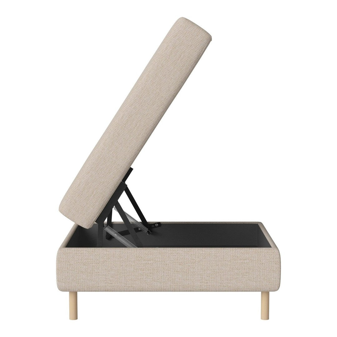 Beige upholstered storage ottoman with wooden legs, showcasing a simple, modern design and subtle texture.