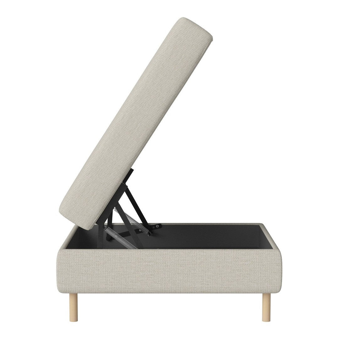 Light gray upholstered storage bed with wood legs and a clean, minimalist design for modern decor.