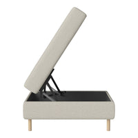 Light gray upholstered storage bed with natural wood legs and a clean, minimalist design.