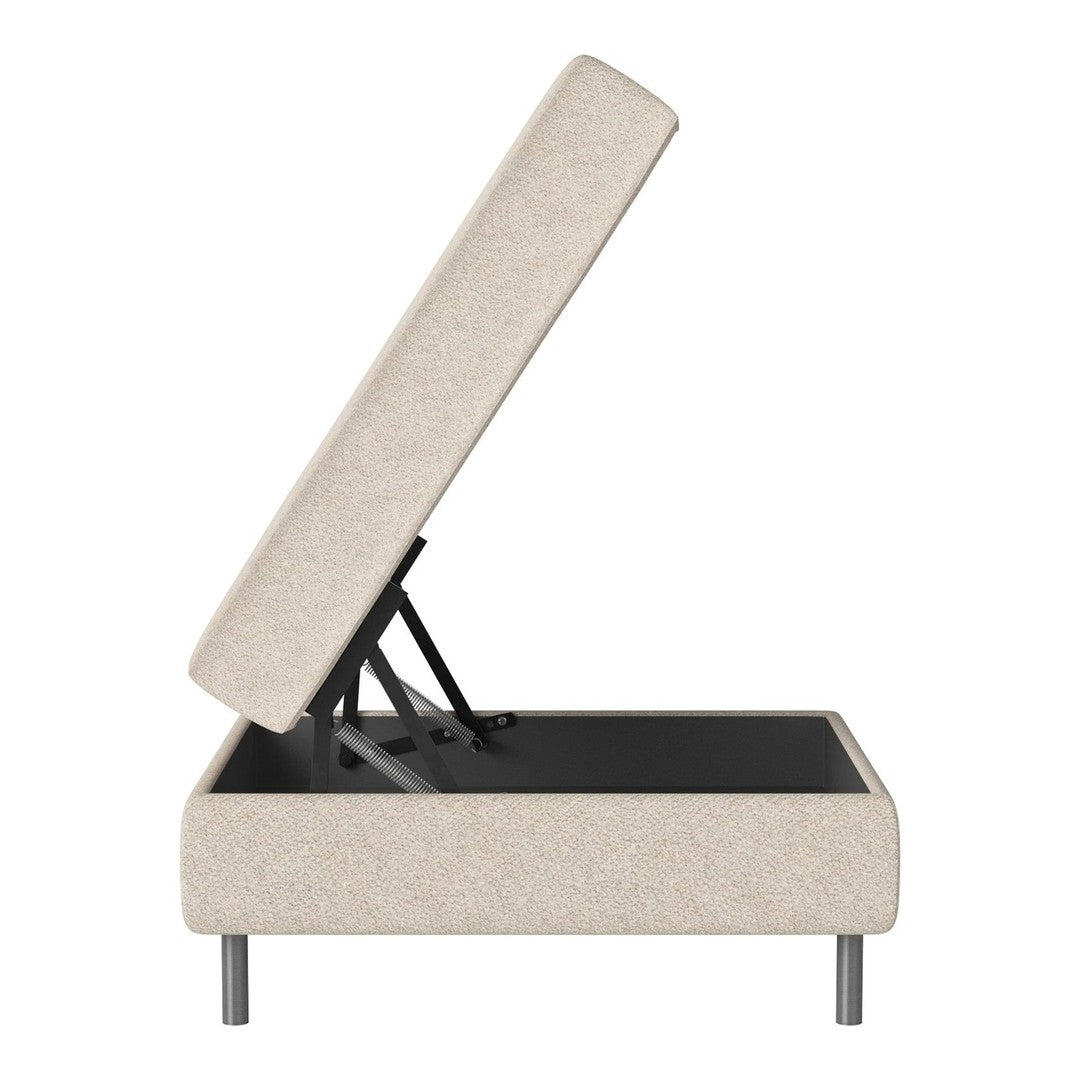 Beige upholstered storage bed with lift-top, featuring a minimalist design and sleek black base.