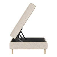 Beige upholstered storage ottoman with a minimalist design and light wood legs, featuring a smooth, textured surface.