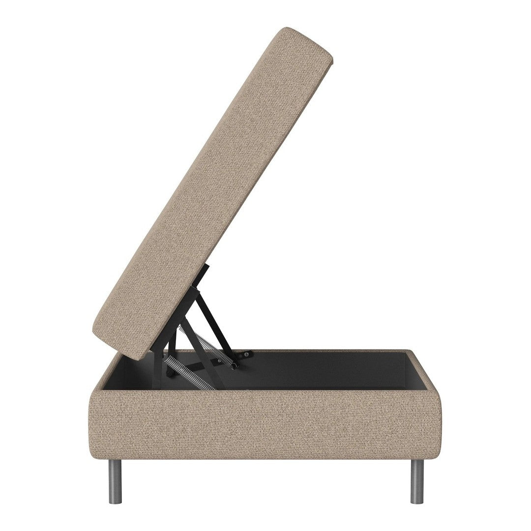Light beige upholstered storage ottoman with a clean design and minimalistic gray legs, showcasing a sleek, modern look.