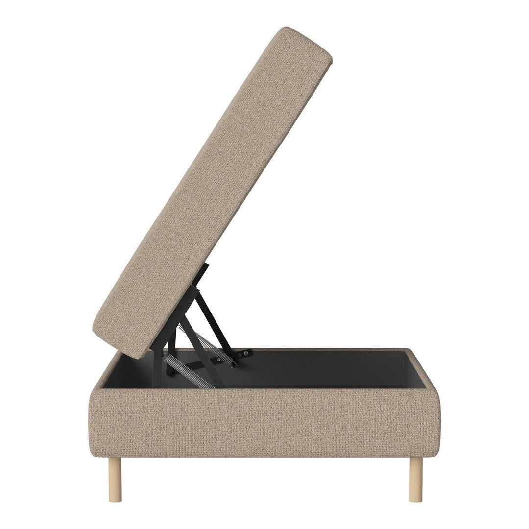 Beige upholstered ottoman with a sleek design and light wooden legs, featuring a modern, minimalistic style.