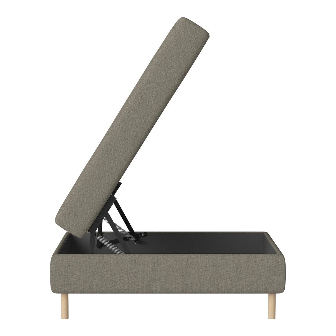 Gray upholstered storage bed frame with a soft fabric finish and light wood legs. Sleek, minimalist design.