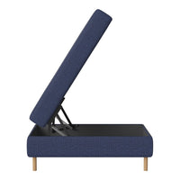 Navy blue upholstered storage bed with a textured pattern, featuring wooden legs for a modern look.