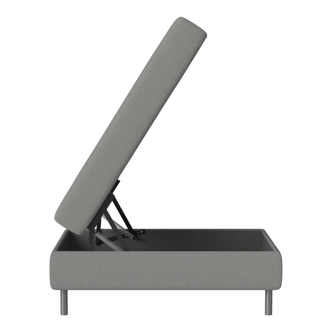 Gray upholstered ottoman with clean lines, showcasing a minimalist design and hidden storage feature.