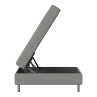 Gray upholstered ottoman with clean lines, showcasing a minimalist design and hidden storage feature.