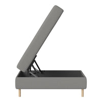 Gray upholstered storage bed with a modern design and light wood legs, featuring a clean, minimalist style.